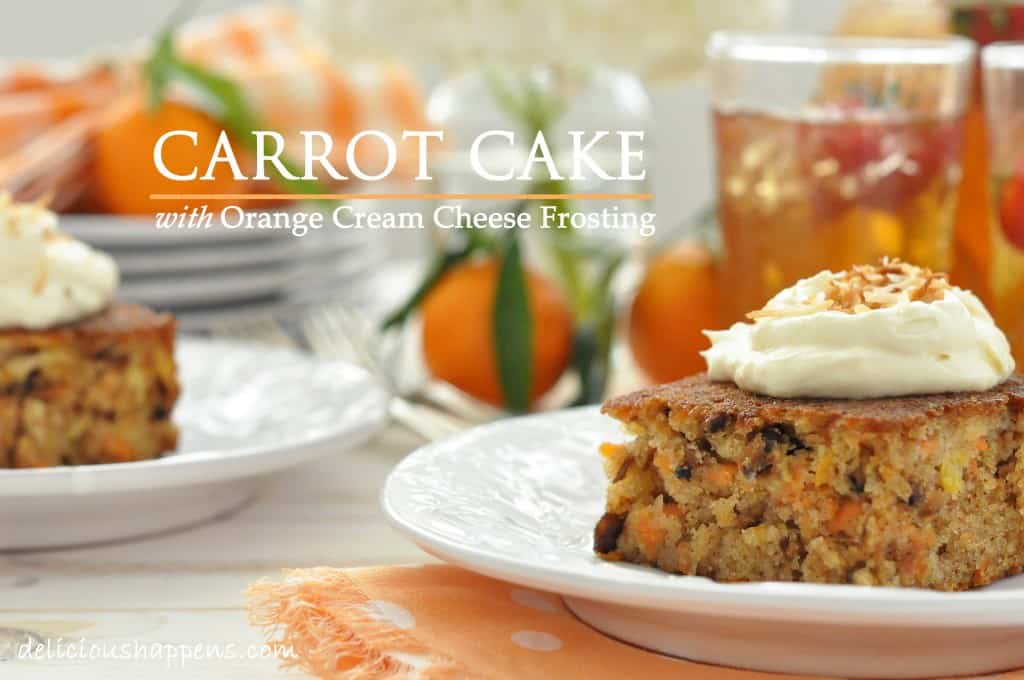 Two white plates with carrot cake squares on them.