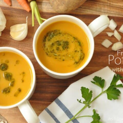Two white cups filled with French Potage Soup.