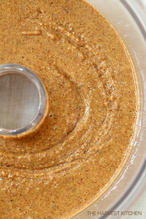 A food processor filled with homemade almond butter.