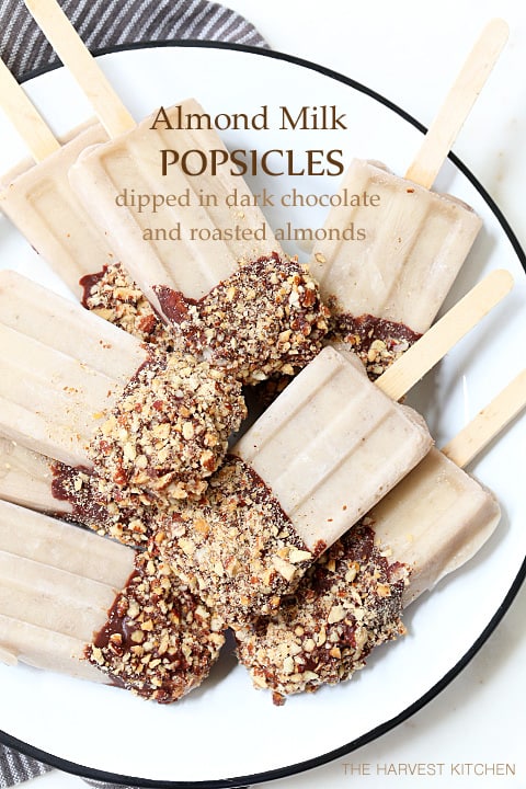 These Almond Milk Popsicle are made with almond milk, almond butter, bananas and Greek yogurt, then dipped in chocolate sauce and rolled in toasted almonds