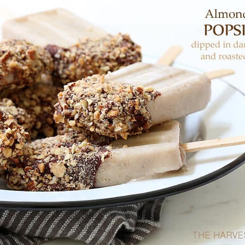 These Almond Milk Popsicle are made with almond milk, almond butter, bananas and Greek yogurt, then dipped in chocolate sauce and rolled in toasted almonds