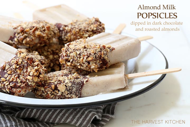 A white plate filled with Almond Milk Popsicles.