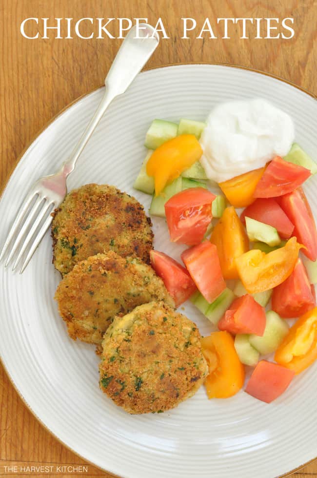Plate of chickpea patties and tomato wedges.