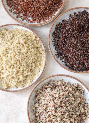 Four bowls of cooked quinoa