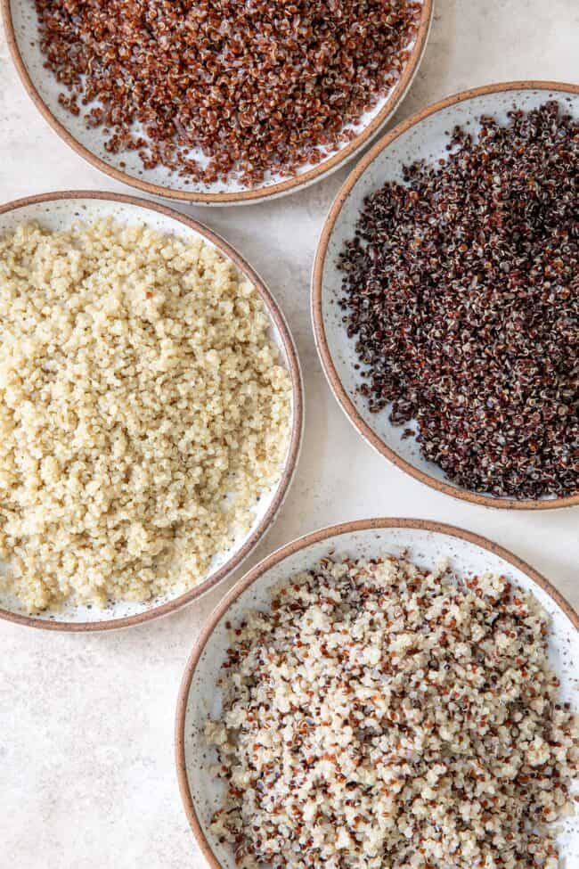 Four bowls of cooked quinoa