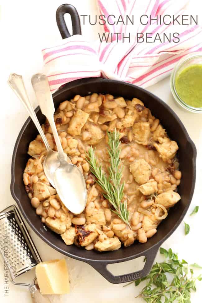 A cast iron skillet filled with Tuscan chicken skillet.