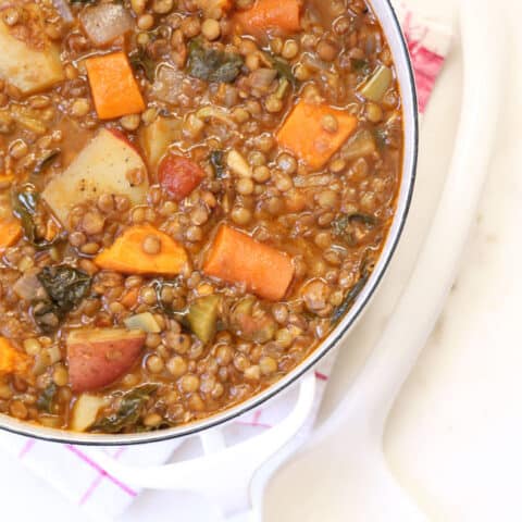 Large white pot filled with vegan lentil stew