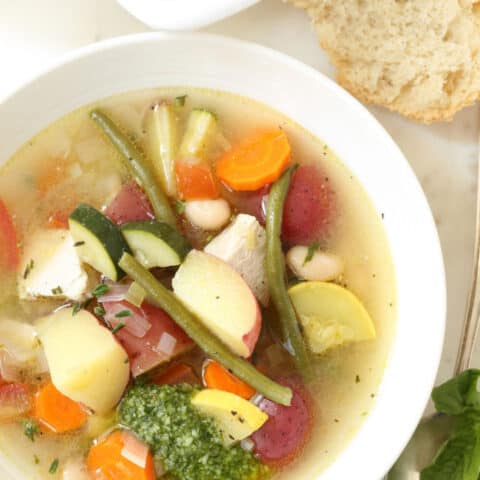 A white bowl filled with Soupe au Pistou.