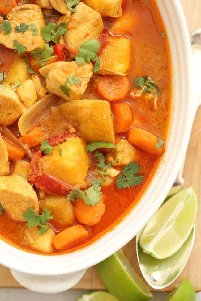 A white bowl filled with Thai Coconut curry Chicken. 