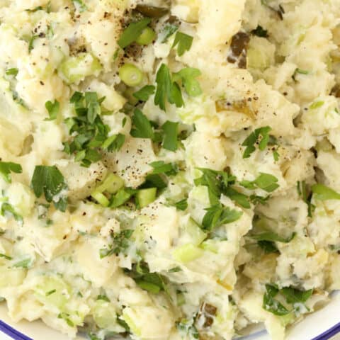 This creamy Dill Pickle Potato Salad is made with potatoes, celery, green onion, parsley and dill pickles all tossed in a light dressing