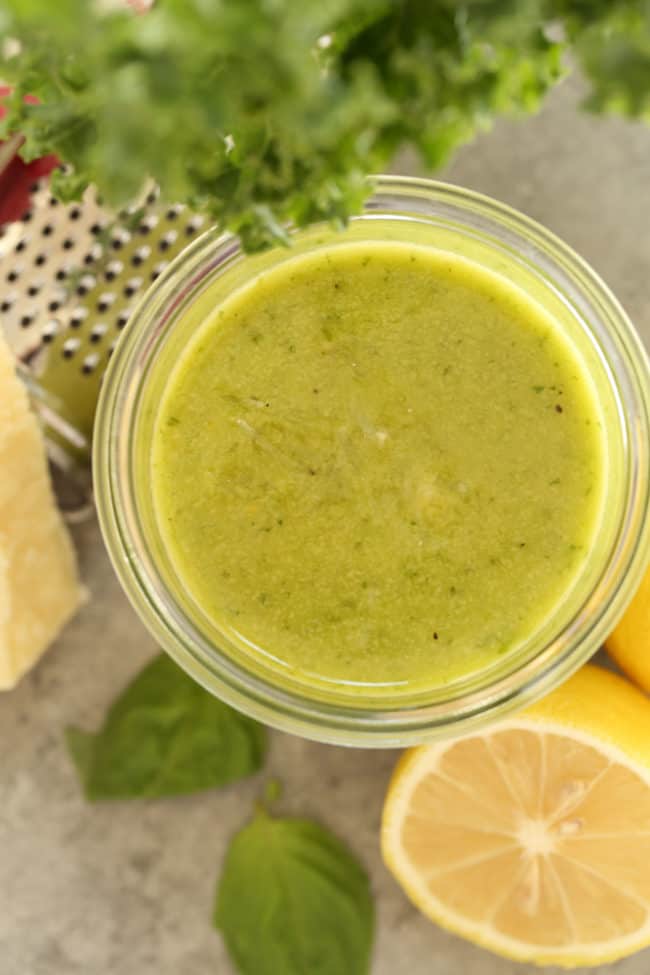 jar of green herb dressing with kale