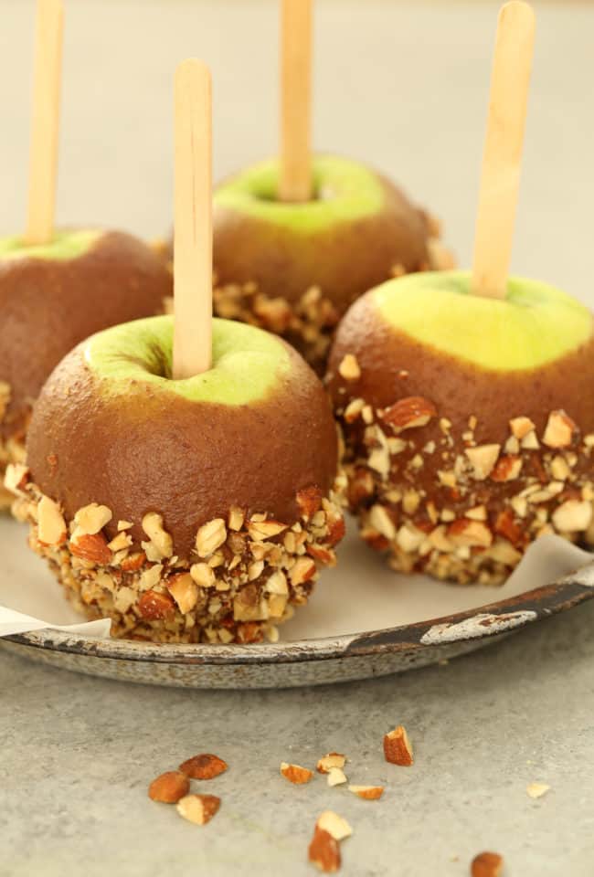 Four pieces of fruit dipped in date dip.