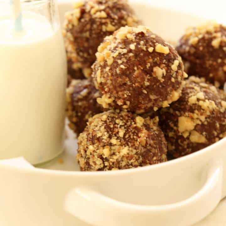 A round white bowl of Raw Brownie Bites.
