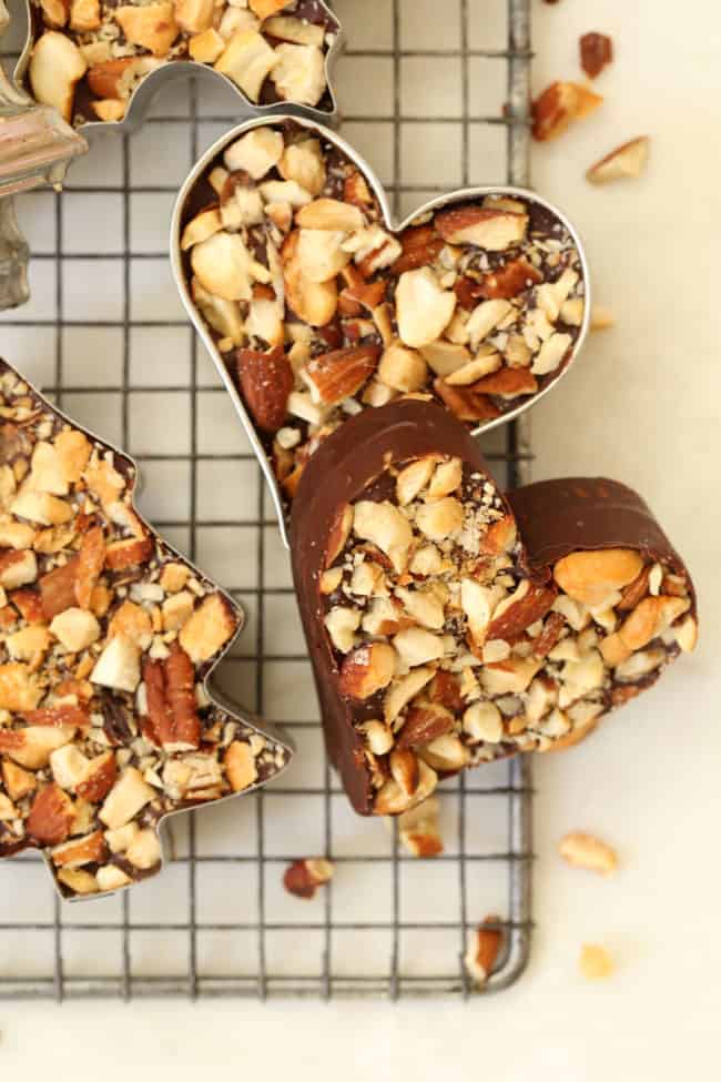 Pieces of chocolate bark set out on a wire cooling rack.