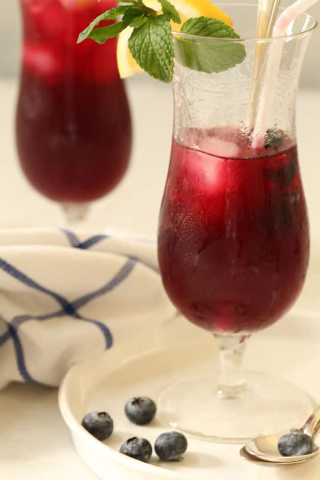 Iced blueberry tea in two glasses.