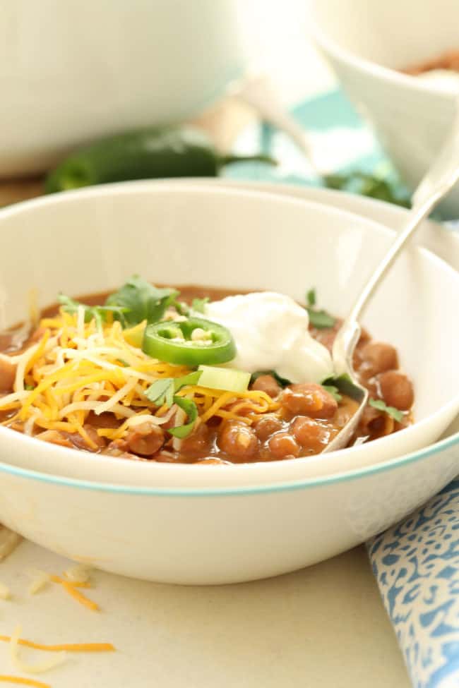 bowl of Mexican beans with cheese and sour cream