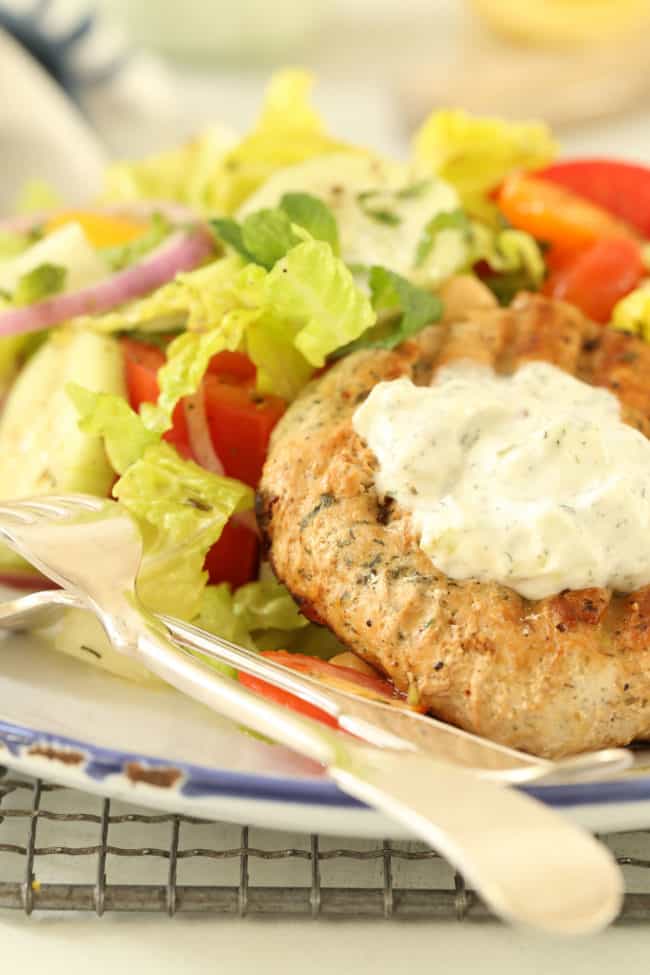 plate of grilled turkey patty and salad