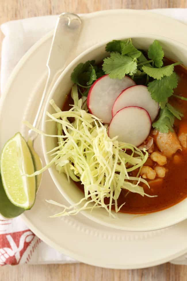 Mexican Chicken Posole (also referred to as chicken pozole) is a  richly flavored soup made with chicken, hominy, garlic and onion all simmered in a broth with authentic Mexican flavors