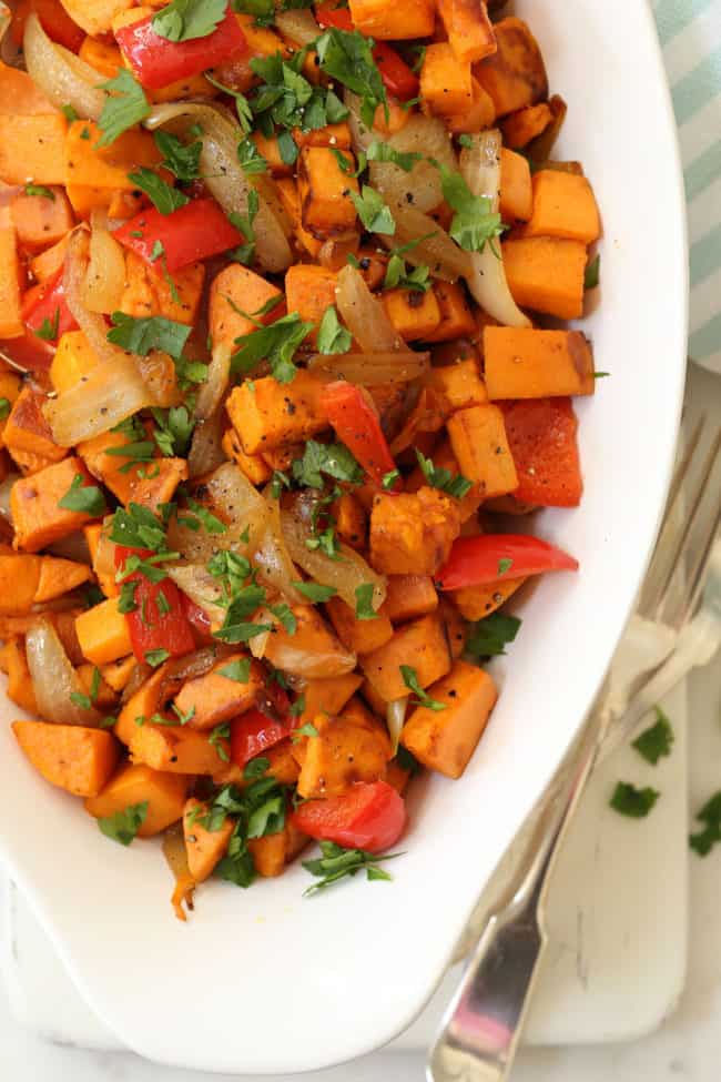 These Breakfast Sweet Potatoes are studded with red bell pepper, garlic and onions