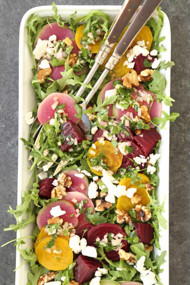 This Colorful Beet Salad is made with baby beets, arugula, feta cheese, walnuts, all tossed in a richly flavored shallot vinaigrette 