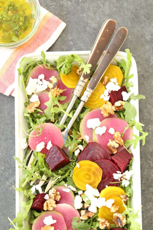 This Colorful Beet Salad is made with baby beets, arugula, feta cheese, walnuts, all tossed in a richly flavored shallot vinaigrette 