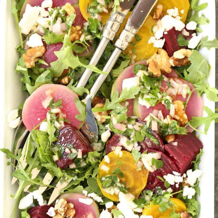 This Colorful Beet Salad is made with baby beets, arugula, feta cheese, walnuts, all tossed in a richly flavored shallot vinaigrette
