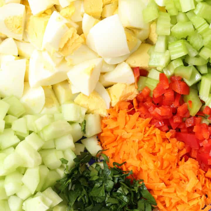 A white bowl filled with loaded low fat egg salad.