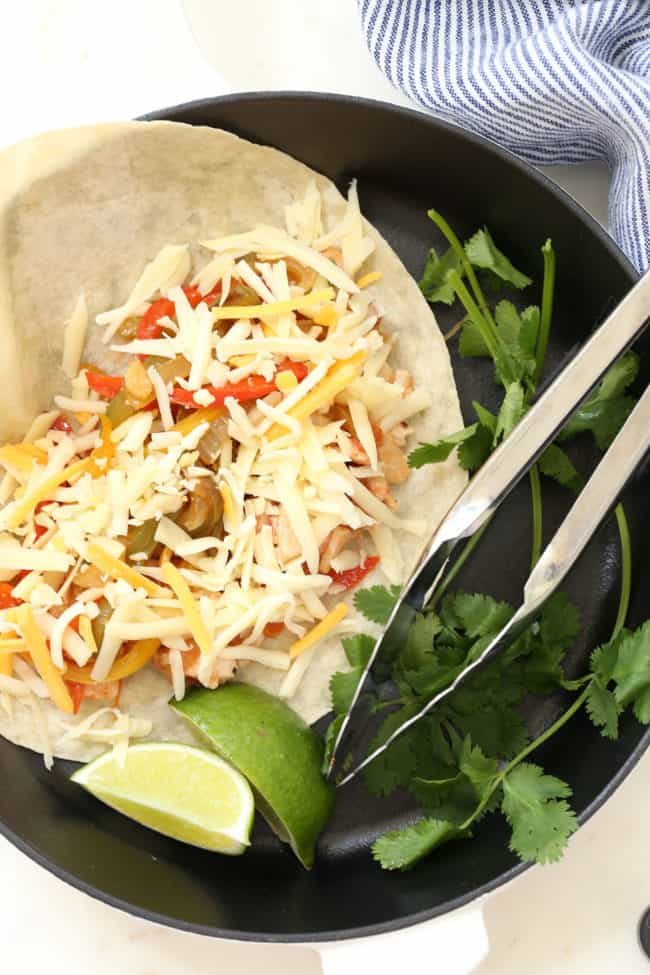 skillet of grilled chicken and vegetables- homemade Mexican food