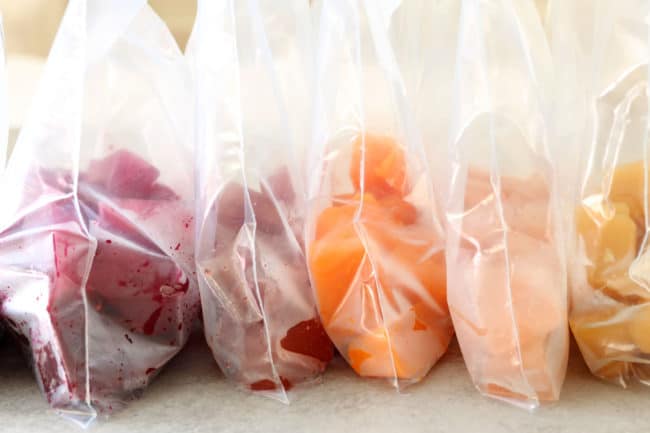 freezer baggies filled with fruit juice ice cubes