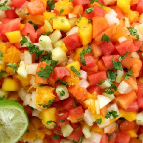 A white bowl filled with Mexican Fruit Salad.