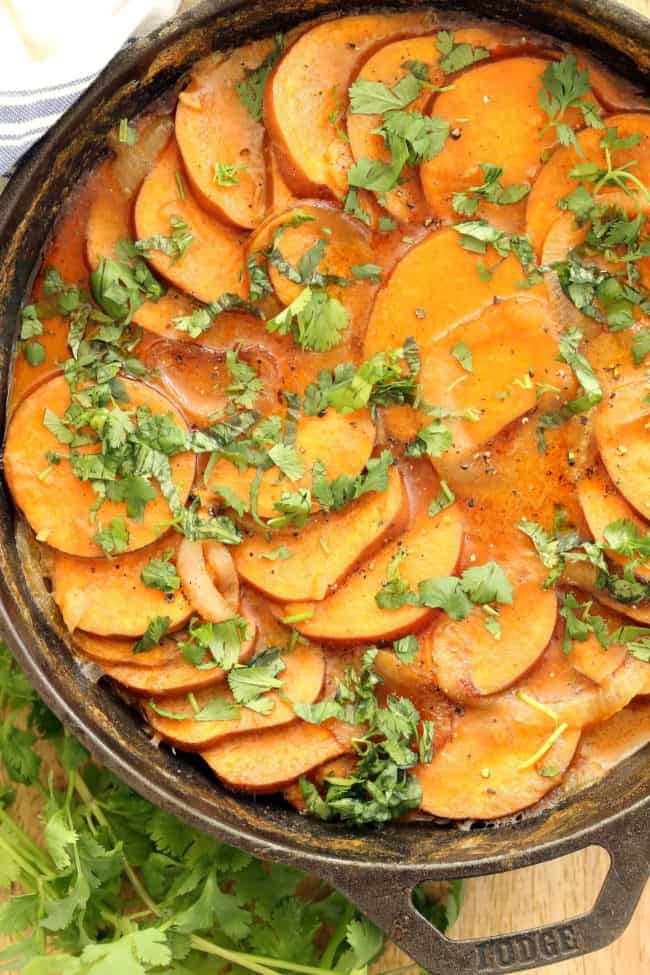 These Coconut Curry Scalloped Sweet Potatoes are made with layers of sweet potatoes, sautéed onion and garlic simmered in a delicious coconut curry sauce