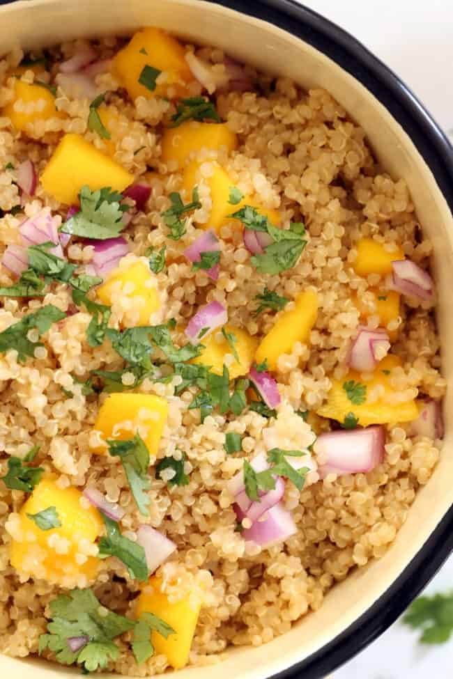 A white pot filled with pineapple flavored quinoa.