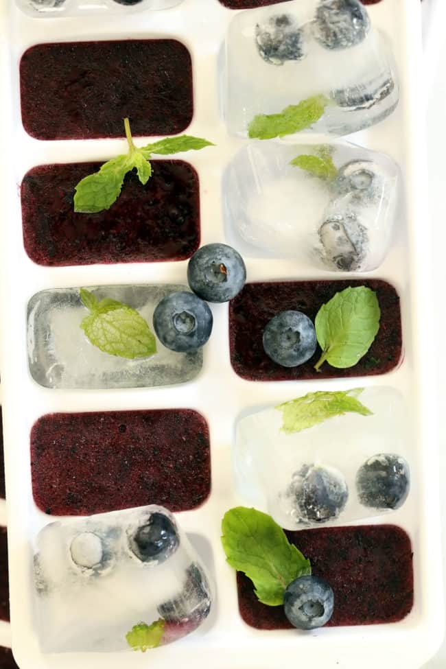 A white tray filled with frozen fruit juice.