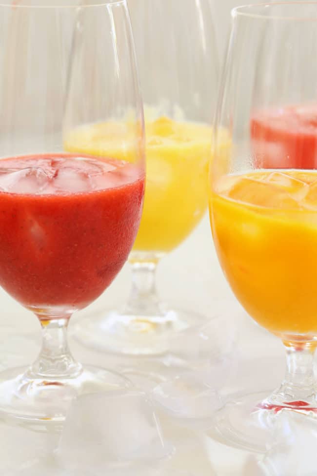 Several glasses of agua fresca (fruit water).