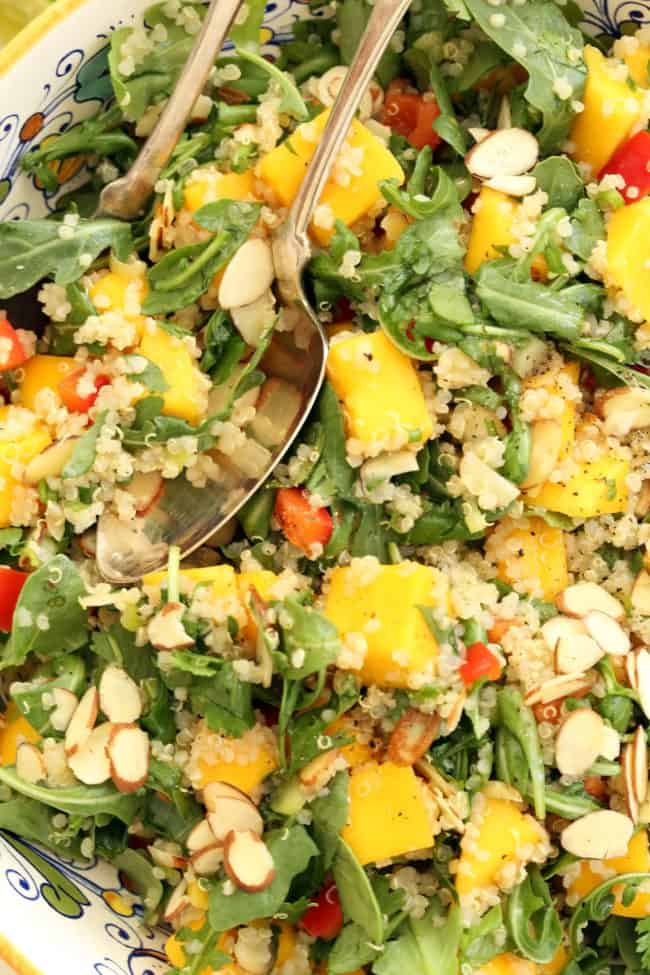 bowl of tossed arugula salad 