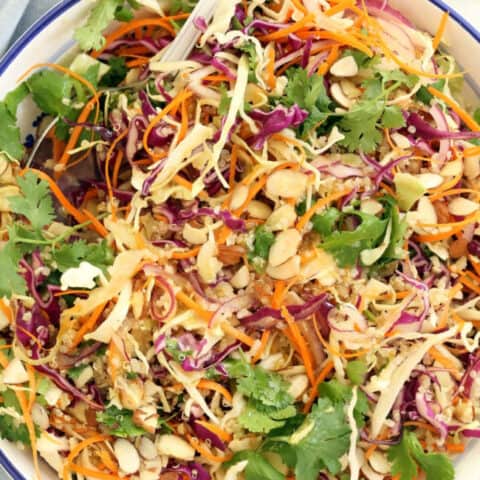 This Asian Quinoa Salad is made with green and red cabbage, carrot, cilantro, onion and quinoa all tossed in a delicious Asian ginger salad dressing