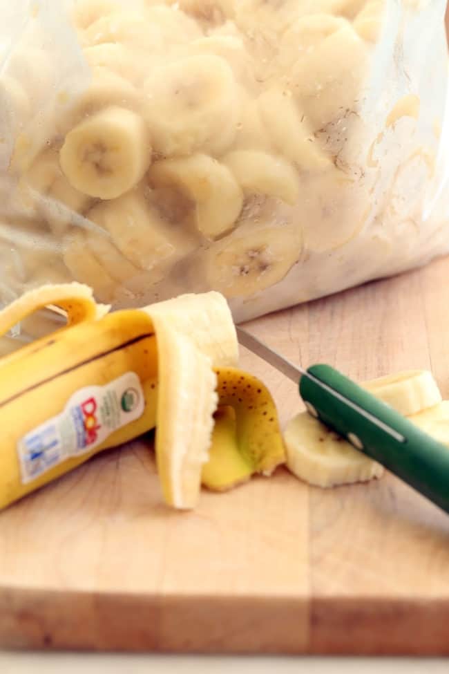 A freezer bag filled with frozen banana slices.