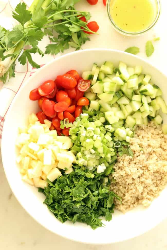 This Crunchy Quinoa Tabbouleh Salad features fresh parsley, mint, green onion, cherry tomatoes, cucumber, and a bit of apple