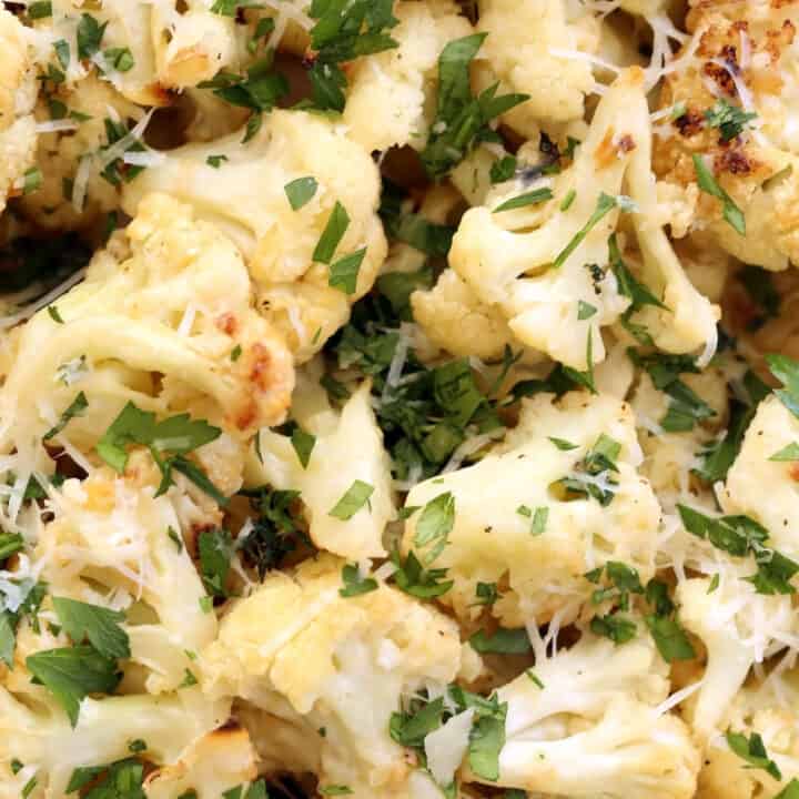 This Garlic Parmesan Roasted Cauliflower is tossed in parmesan cheese and makes an easy healthy side dish to serve any night of the week