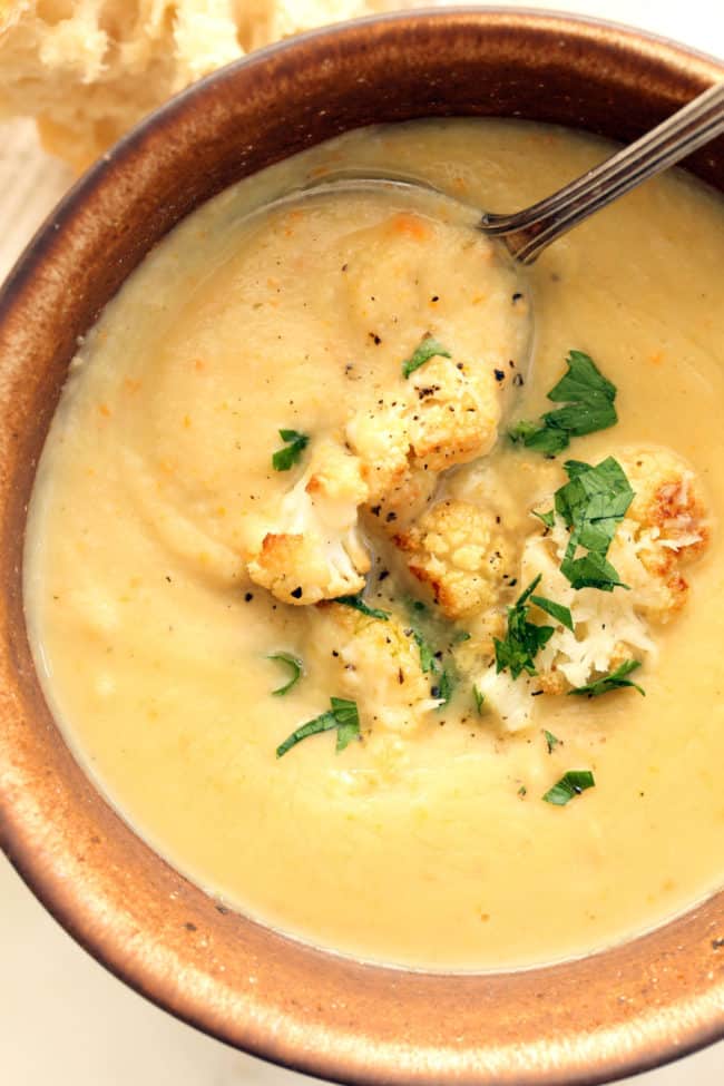 A cup of creamy cauliflower soup.