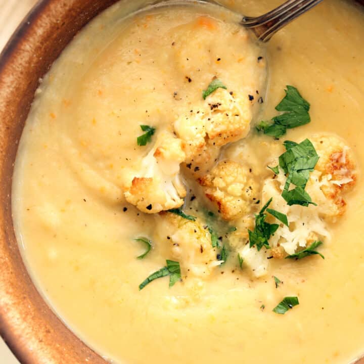 A cup of creamy cauliflower soup.