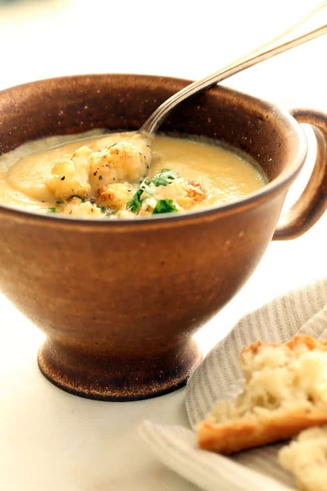 A cup of creamy cauliflower soup.