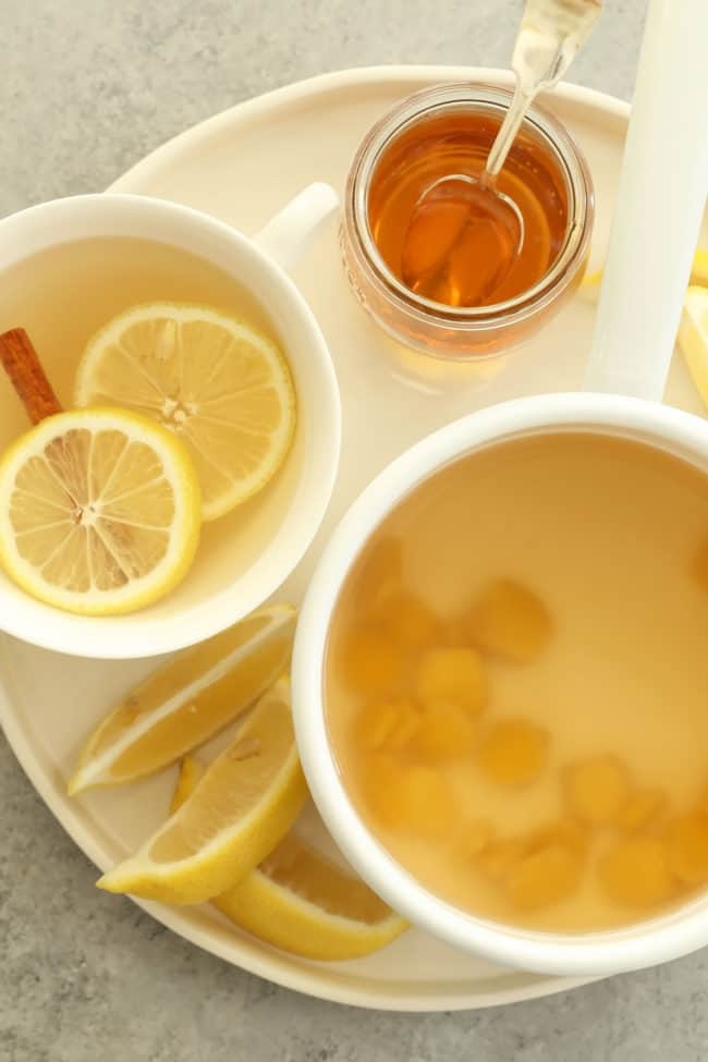 A white cup filled with homemade ginger tea.