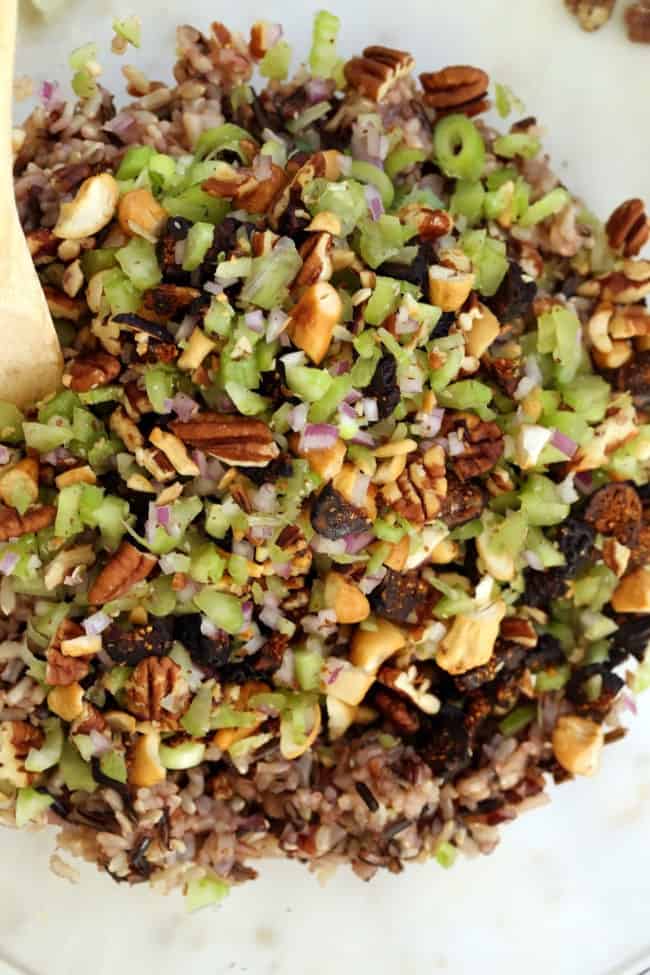 A white bowl filled with wild rice salad.