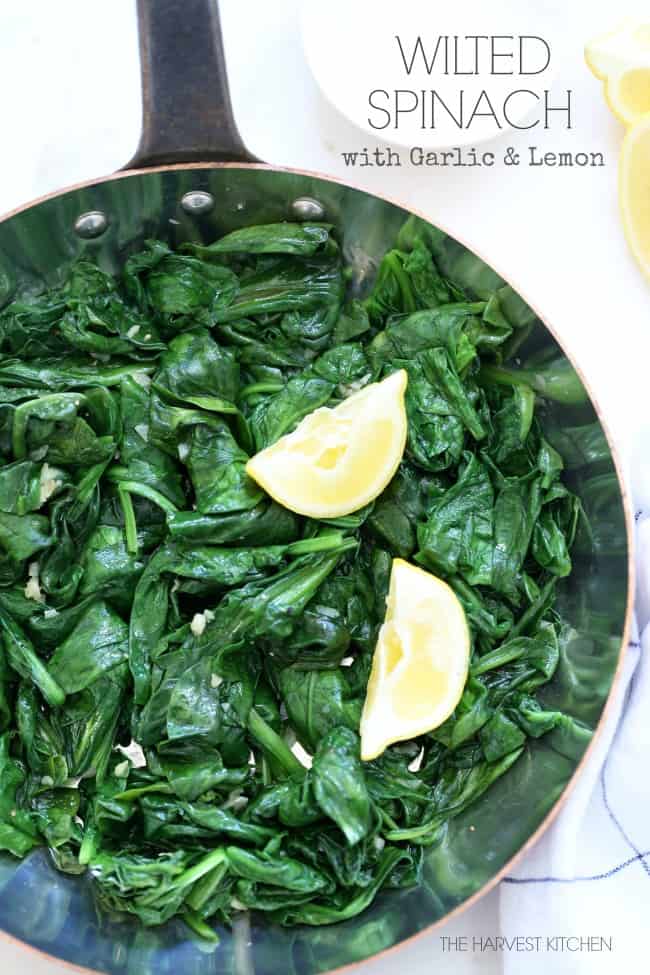 A skillet filled with steamed spinach.