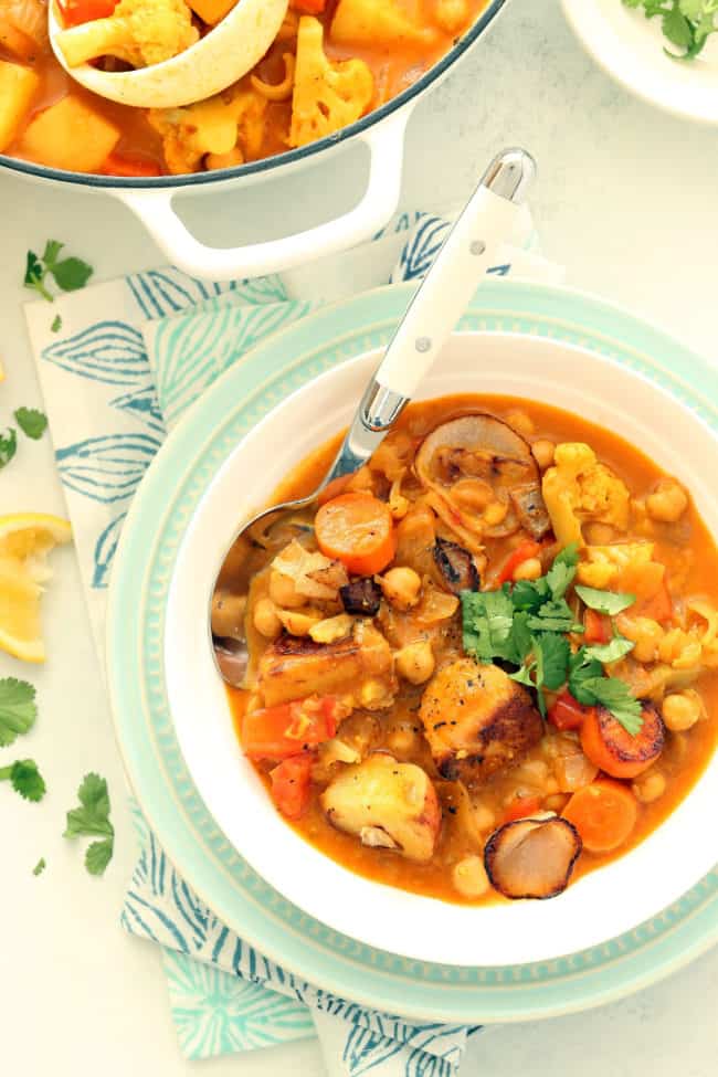 A white bowl filled with chickpea stew.