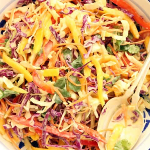 A bowl of cabbage mango slaw.