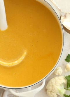 This Curried Roasted Cauliflower Soup is  made with roasted cauliflower, onion, garlic, coconut milk and seasoned with delicious curry