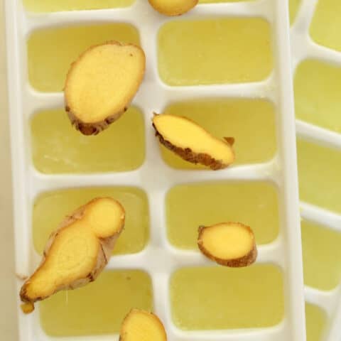 A white tray filled with ginger ice cubes.