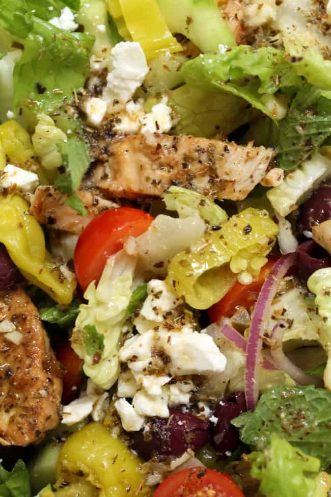 This Greek Chopped Salad is loaded a variety of fresh organic vegetables, marinated grilled chicken, hardboiled eggs and it's all tossed in a delicious Greek salad dressing